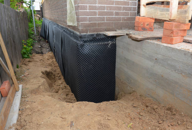 Happy homeowners after waterproofing job in Pruden